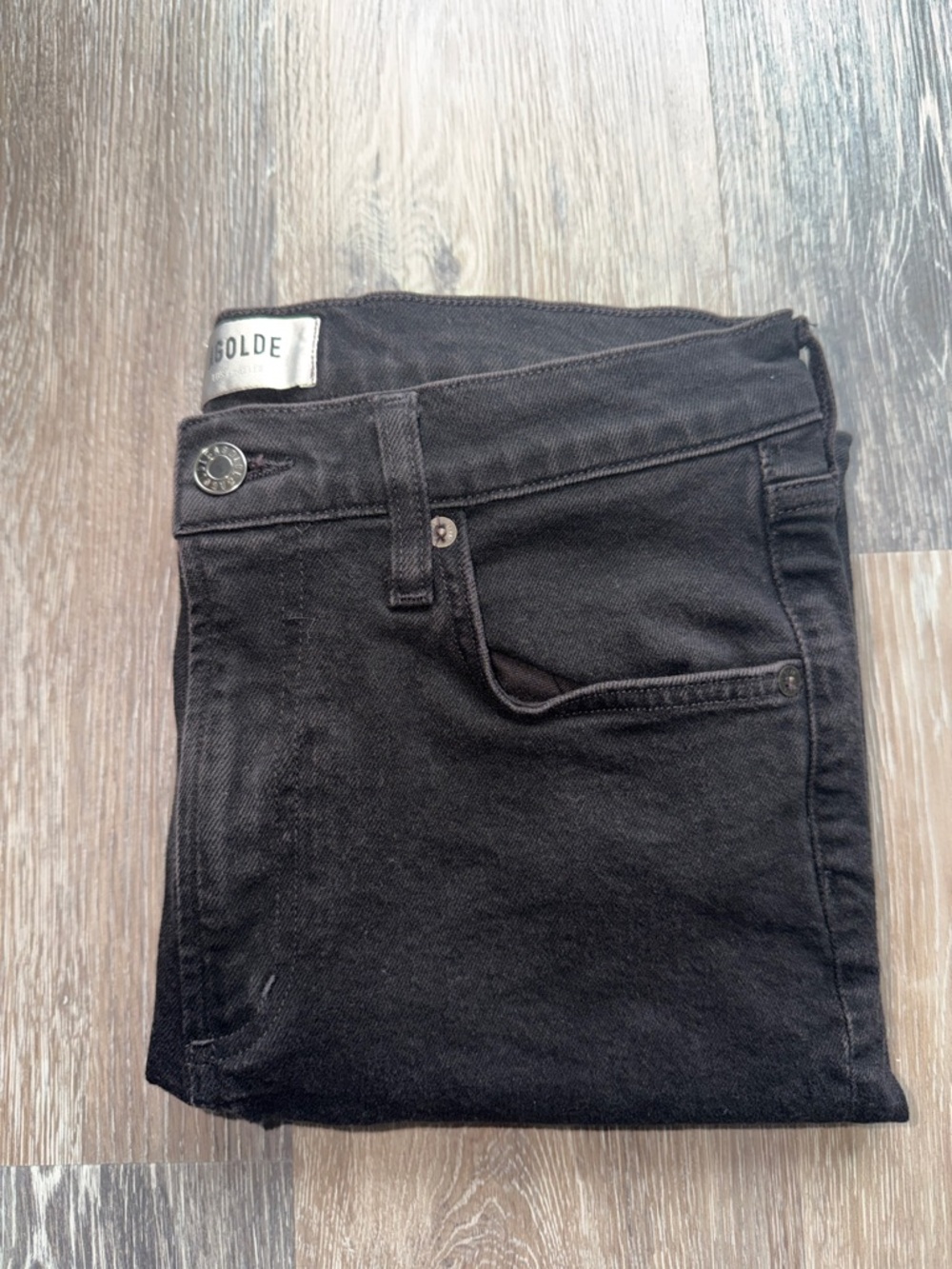 Folded Black Jeans with Visible Waist Label